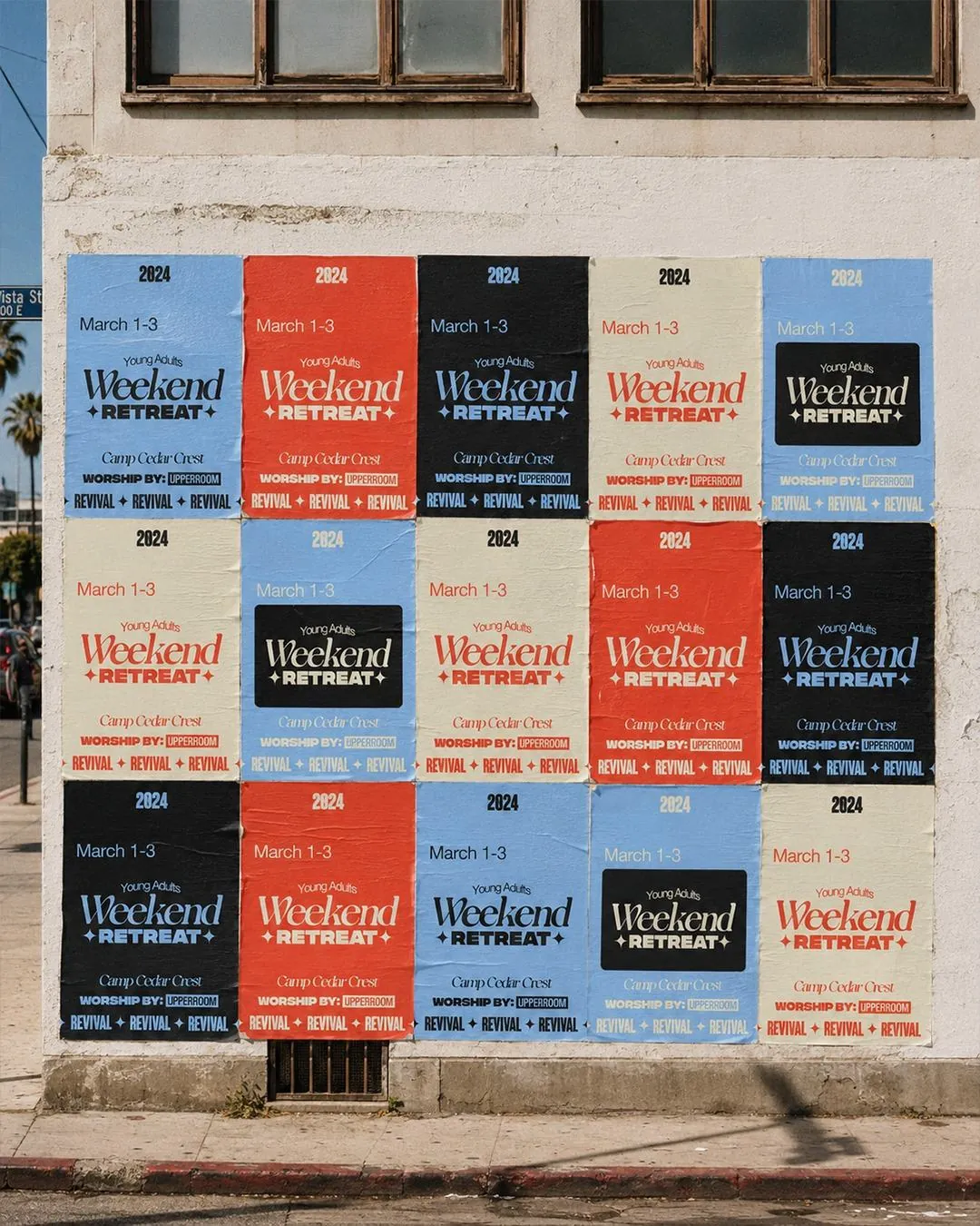 Weekend Retreat posters wheatpasted across a wall